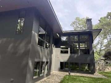 Contemporary dark-sided home exterior cleaned by Eagle Eye Cleaning