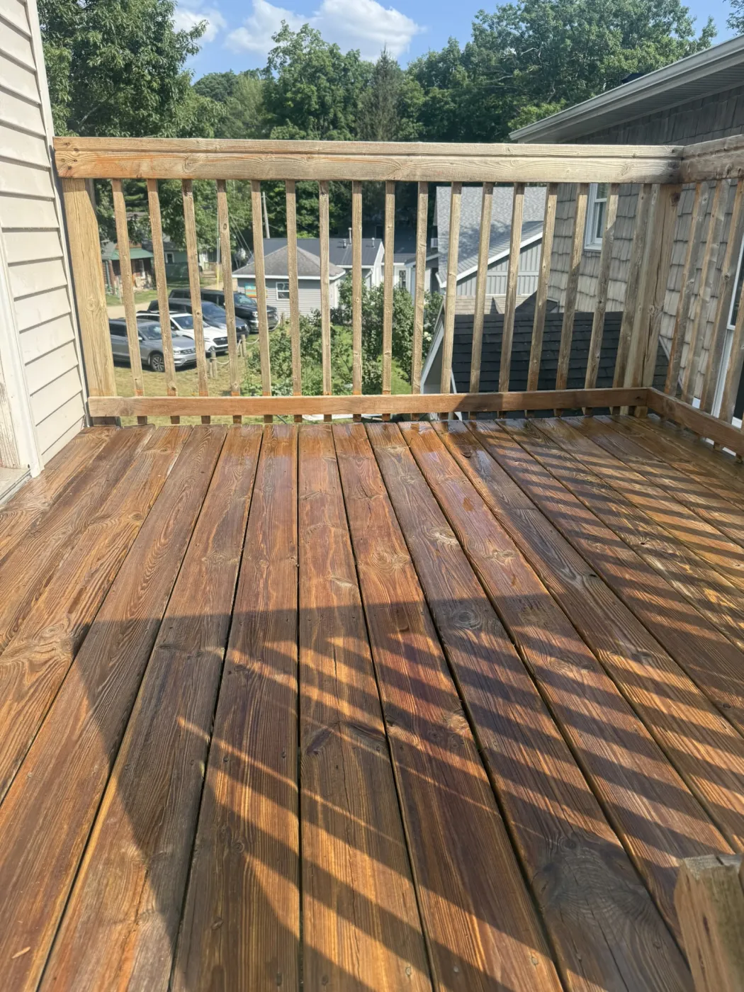 Deck restored to rich natural wood tone after cleaning